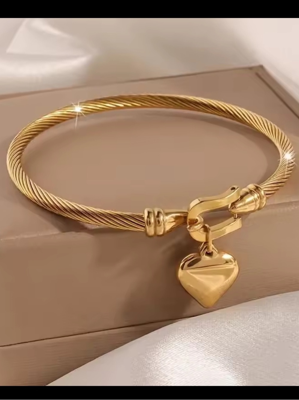 Gold Twisted Cable Bangle with Heart Charm